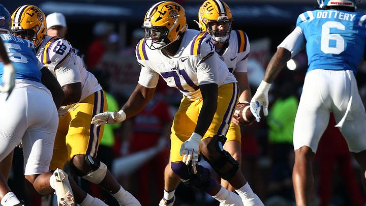 Sep 27, 2025; Oxford, Mississippi, USA; LSU Tigers offensive lineman Tyree Adams (71) blocks during the third quarter against the Mississippi Rebels at Vaught-Hemingway Stadium. Mandatory Credit: Petre Thomas-Imagn Images Sep 27, 2025; Oxford, Mississippi, USA; LSU Tigers offensive lineman Tyree Adams (71) blocks during the third quarter against the Mississippi Rebels at Vaught-Hemingway Stadium. Mandatory Credit: Petre Thomas-Imagn Images