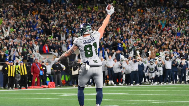 Dec 18, 2025; Seattle, Washington, USA; Seattle Seahawks tight end Eric Saubert (81) makes a catch for a game-winning two-point conversion against the Los Angeles Rams in overtime at Lumen Field. Mandatory Credit: Steven Bisig-Imagn Images
