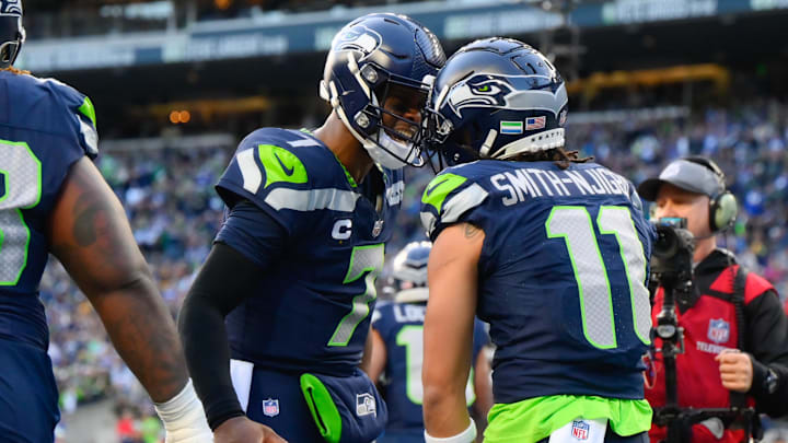 Dec 31, 2023; Seattle, Washington, USA; Seattle Seahawks quarterback Geno Smith (7) and wide