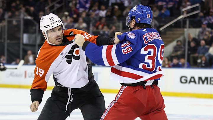 Feb 26, 2026; New York, New York, USA;  Philadelphia Flyers right wing Garnet Hathaway (19) and New York Rangers center Sam Carrick (39) at Madison Square Garden. Mandatory Credit: Wendell Cruz-Imagn Images