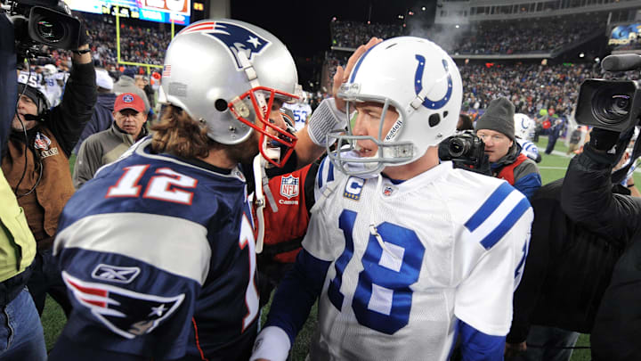 Indianapolis Colts quarterback Peyton Manning, right, meets with New England Patriots quarterback Tom Brady after a game at Gillette Stadium on Nov. 21, 2010. The Colts lost 31-28.