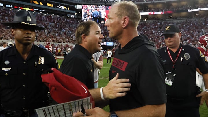 Oct 26, 2024; Tuscaloosa, Alabama, USA;  Missouri Tigers head coach Eliah Drinkwitz (left) talks with Alabama Crimson Tide head coach Kalen DeBoer (right) after a game at Bryant-Denny Stadium. Mandatory Credit: Butch Dill-Imagn Images