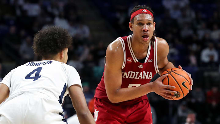 Indiana Hoosiers forward Malik Reneau (5) holds the ball as Penn State Nittany Lions guard/forward Puff Johnson (4) defends during the second half at Bryce Jordan Center. Penn State defeated Indiana 83-74. Indiana Hoosiers forward Malik Reneau (5) holds the ball as Penn State Nittany Lions guard/forward Puff Johnson (4) defends during the second half at Bryce Jordan Center. Penn State defeated Indiana 83-74.