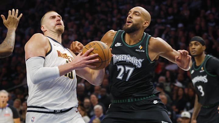 Apr 23, 2026; Minneapolis, Minnesota, USA; Denver Nuggets center Nikola Jokic (15) goes to the basket against Minnesota Timberwolves center Rudy Gobert (27) in the third quarter at Target Center. Mandatory Credit: Bruce Kluckhohn-Imagn Images