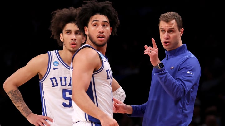 Mar 24, 2024; Brooklyn, NY, USA; Duke Blue Devils head coach Jon Scheyer talks to guards Jared McCain (0) and Tyrese Proctor (5) during the second half against the James Madison Dukes at Barclays Center. Mandatory Credit: Brad Penner-USA TODAY Sports