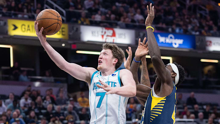 Nov 19, 2025; Indianapolis, Indiana, USA; Charlotte Hornets guard Kon Knueppel (7) shoots the ball while  Indiana Pacers forward Pascal Siakam (43) defends in the first half at Gainbridge Fieldhouse. Mandatory Credit: Trevor Ruszkowski-Imagn Images