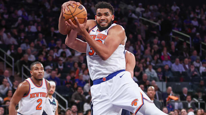 Jan 19, 2026; New York, New York, USA;  New York Knicks center Karl-Anthony Towns (32) rebounds the ball against the Dallas Mavericks during the fourth quarter at Madison Square Garden.