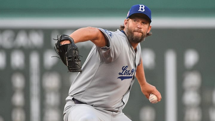 Jul 26, 2025; Boston, Massachusetts, USA; Los Angeles Dodgers starting pitcher Clayton Kershaw (22) pitches  during the first inning against the Boston Red Sox at Fenway Park. 