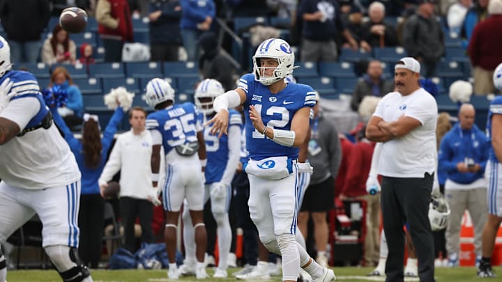 Nov 18, 2023; Provo, Utah, USA; Brigham Young Cougars quarterback Jake Retzlaff (12) warms up before their game.