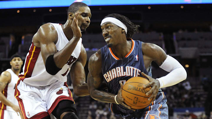 February 4, 2011; Charlotte, NC, USA; Charlotte Bobcats forward Gerald Wallace (3) drives to the basket against Miami Heat forward Chris Bosh (1) in the first half at Time Warner Cable Arena. Mandatory Credit: Sam Sharpe-Imagn Images