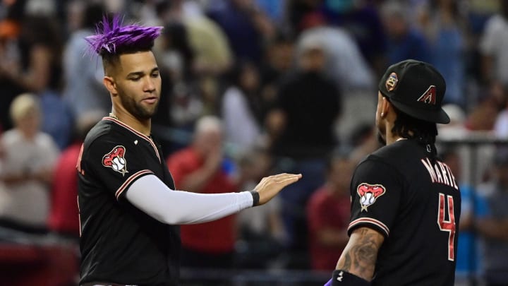 Sep 19, 2023; Phoenix, Arizona, USA; Arizona Diamondbacks left fielder Lourdes Gurriel Jr. (12) and second baseman Ketel Marte (4) celebrate after beating the San Francisco Giants 804 at Chase Field. Mandatory Credit: Matt Kartozian-USA TODAY Sports Sep 19, 2023; Phoenix, Arizona, USA; Arizona Diamondbacks left fielder Lourdes Gurriel Jr. (12) and second baseman Ketel Marte (4) celebrate after beating the San Francisco Giants 804 at Chase Field. Mandatory Credit: Matt Kartozian-USA TODAY Sports