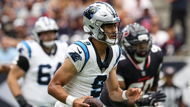 Aug 16, 2025; Houston, Texas, USA; Carolina Panthers quarterback Bryce Young (9) scrambles against the Houston Texans in the first quarter at NRG Stadium. Mandatory Credit: Thomas Shea-Imagn Images