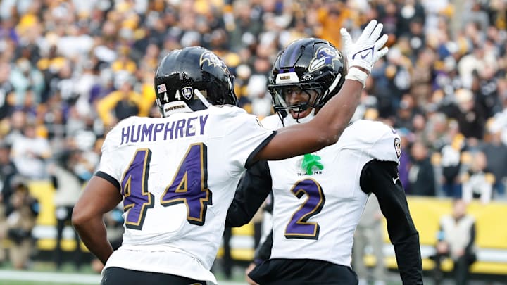 Nov 17, 2024; Pittsburgh, Pennsylvania, USA;  Baltimore Ravens cornerback Marlon Humphrey (44) celebrates with cornerback Nate Wiggins (2) after Humphrey intercepted a pass in the end-zone intended for Pittsburgh Steelers tight end Darnell Washington (not pictured) during the fourth quarter at Acrisure Stadium. Mandatory Credit: Charles LeClaire-Imagn Images