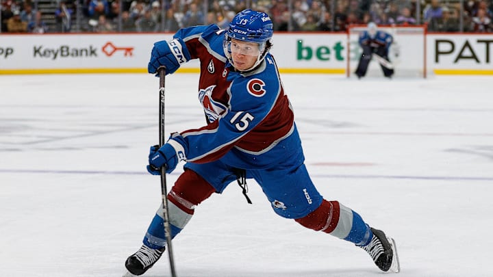 Nov 11, 2025; Denver, Colorado, USA; Colorado Avalanche defenseman Jack Ahcan (15) attempts a shot in the second period against the Anaheim Ducks at Ball Arena. Mandatory Credit: Isaiah J. Downing-Imagn Images Nov 11, 2025; Denver, Colorado, USA; Colorado Avalanche defenseman Jack Ahcan (15) attempts a shot in the second period against the Anaheim Ducks at Ball Arena. Mandatory Credit: Isaiah J. Downing-Imagn Images
