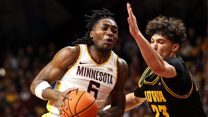 Jan 6, 2026; Minneapolis, Minnesota, USA; Minnesota Golden Gophers guard Langston Reynolds (6) works around Iowa Hawkeyes guard Isaia Howard (23) during the first half at Williams Arena. Mandatory Credit: Matt Krohn-Imagn Images Jan 6, 2026; Minneapolis, Minnesota, USA; Minnesota Golden Gophers guard Langston Reynolds (6) works around Iowa Hawkeyes guard Isaia Howard (23) during the first half at Williams Arena. Mandatory Credit: Matt Krohn-Imagn Images