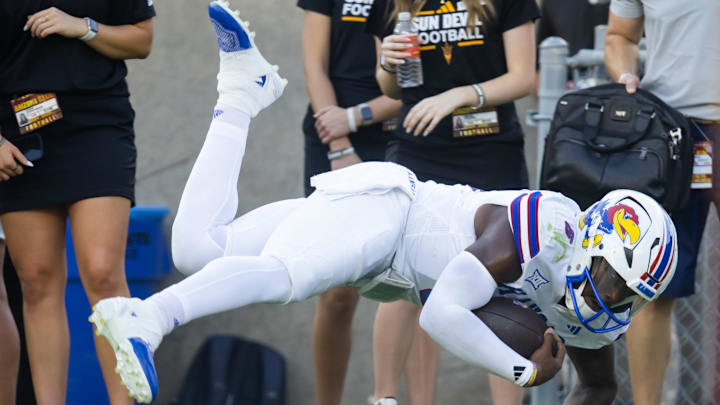 Oct 5, 2024; Tempe, Arizona, USA; Kansas Jayhawks quarterback Jalon Daniels (6) dives into the end zone for a touchdown against the Arizona State Sun Devils in the first half at Mountain America Stadium. Mandatory Credit: Mark J. Rebilas-Imagn Images