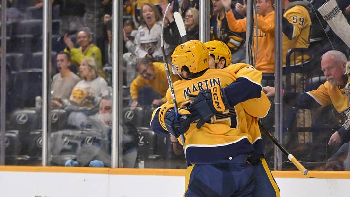 Oct 11, 2025; Nashville, Tennessee, USA;  Nashville Predators left wing Filip Forsberg (9) celebrates goal with center Brady Martin (44) against the Utah Mammoth during the first period at Bridgestone Arena. Mandatory Credit: Steve Roberts-Imagn Images