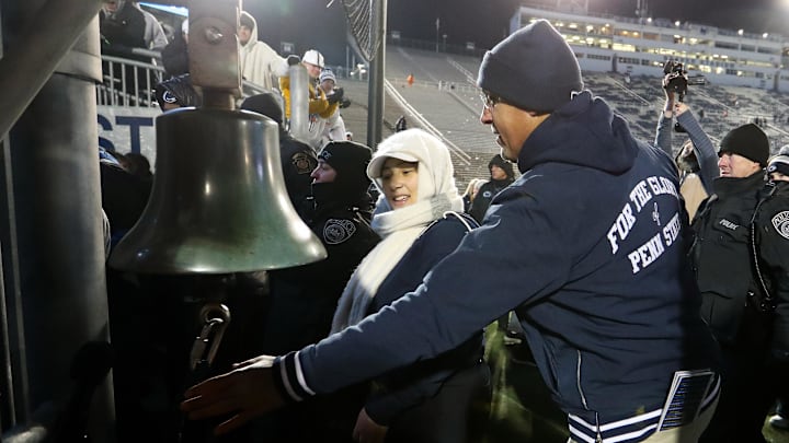 Penn State football coach James Franklin rings the Beaver Stadium victory bell after the Nittany Lions' win over the Maryland Terrapins. 