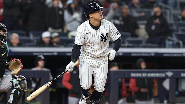 Apr 2, 2025; Bronx, New York, USA; New York Yankees shortstop Anthony Volpe (11) hits a three run home run during the ninth inning against the Arizona Diamondbacks at Yankee Stadium.