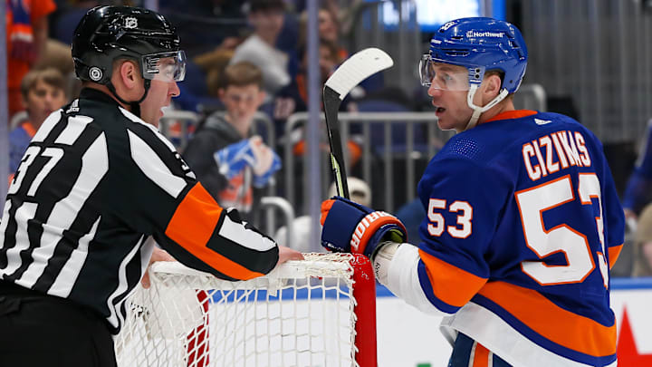 Apr 12, 2022; Elmont, New York, USA; New York Islanders center Casey Cizikas (53) talks with referee