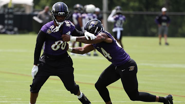 Jun 10, 2025; Baltimore, MD, USA; Baltimore Ravens tight end Isaiah Likely (80) runs past Baltimore Ravens tight end Zaire Mitchell-Paden (84) during an NFL OTA at Under Armour Performance Center. Mandatory Credit: Daniel Kucin Jr.-Imagn Images