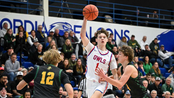 Slinger forward Joey Kohnen (1) passes the ball over the double-team of Freedom guards Sawyer Rueckl (12) and Kaden Vandenberg (4) in a game in the Rick Majerus WBY Shootout on Friday, December 27, 2024, at Concordia University in Mequon, Wisconsin.