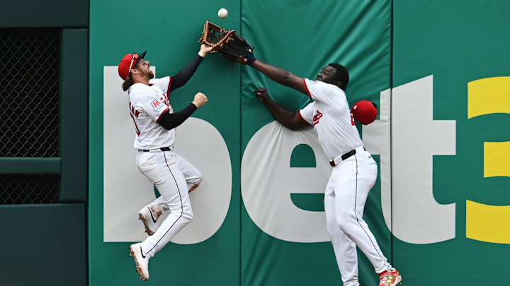 Cleveland Guardians center fielder Daniel Schneemann, left, and  right fielder Jhonkensy Noel go for a ball hit by Minnesota Twins center fielder Byron Buxton during the sixth inning at Progressive Field in Cleveland on May 1, 2025. 