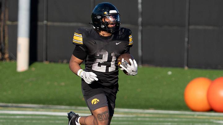 Iowa running back Lendon Phillips Jr. (21) carries the ball back to the line of scrimmage during practice April 9, 2026 in Iowa City, Iowa.