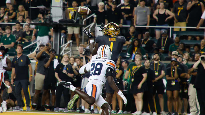 Aug 29, 2025; Waco, Texas, USA;  Baylor Bears tight end Michael Trigg (1) catches a touchdown pass against Auburn Tigers safety Kensley Louidor-Faustin (28) during the second half at McLane Stadium. Mandatory Credit: Chris Jones-Imagn Images