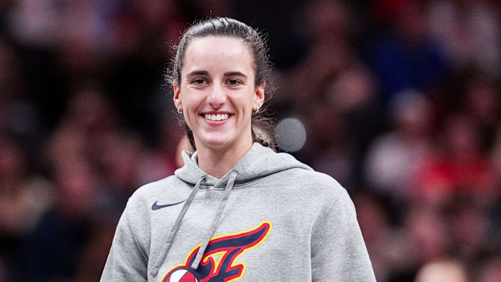 Indiana Fever Caitlin Clark (22) smiles Saturday, May 3, 2025, during a timeout at a preseason game between the Indiana Fever and the Washington Mystics at Gainbridge Fieldhouse in Indianapolis.