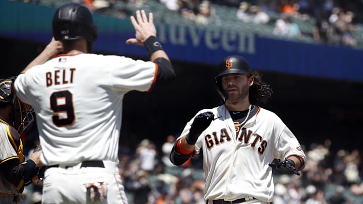 May 8, 2021; San Francisco, California, USA; San Francisco Giants shortstop Brandon Crawford (35) celebrates with first baseman Brandon Belt (9) after hitting a home run during the second inning against the San Diego Padres at Oracle Park.