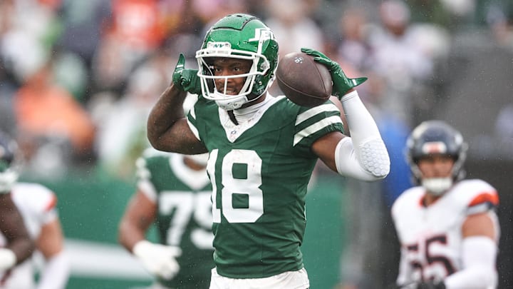 Sep 29, 2024; East Rutherford, New Jersey, USA; New York Jets wide receiver Mike Williams (18) celebrates a first down reception during the second half against the Denver Broncos at MetLife Stadium.