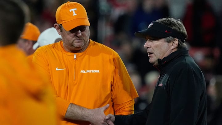 Tennessee head coach Josh Heupel shanks hands with Georgia head coach Kirby Smart before the start of a NCAA college football game against Tennessee in Athens, Ga., on Saturday, Nov. 16, 2024.