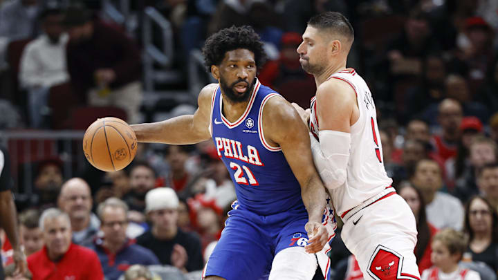 Dec 8, 2024; Chicago, Illinois, USA; Chicago Bulls center Nikola Vucevic (9) defends against Philadelphia 76ers center Joel Embiid (21) during the first half at United Center. Mandatory Credit: Kamil Krzaczynski-Imagn Images Dec 8, 2024; Chicago, Illinois, USA; Chicago Bulls center Nikola Vucevic (9) defends against Philadelphia 76ers center Joel Embiid (21) during the first half at United Center. Mandatory Credit: Kamil Krzaczynski-Imagn Images