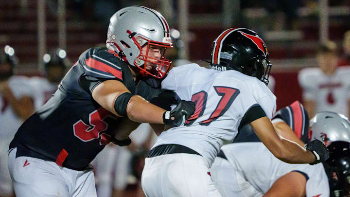 Morton lineman Soren Fifer, left, protects the quarterback in the second half of their Week 4 high school football game against Metamora on Friday, Sept. 19, 2025 in Morton. The Redbirds defeated the Potters 43-40. Morton lineman Soren Fifer, left, protects the quarterback in the second half of their Week 4 high school football game against Metamora on Friday, Sept. 19, 2025 in Morton. The Redbirds defeated the Potters 43-40.