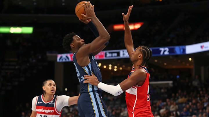 Nov 8, 2024; Memphis, Tennessee, USA; Memphis Grizzlies forward Jaren Jackson Jr. (13) shoots against Washington Wizards forward Alexandre Sarr (20) during the second half at FedExForum. Mandatory Credit: Petre Thomas-Imagn Images