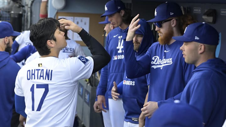 Jun 19, 2025; Los Angeles, California, USA;   Los Angeles Dodgers designated hitter Shohei Ohtani (17) greets starting pitcher Dustin May (85) in the dugout prior to the game against the San Diego Padres at Dodger Stadium. Mandatory Credit: Jayne Kamin-Oncea-Imagn Images