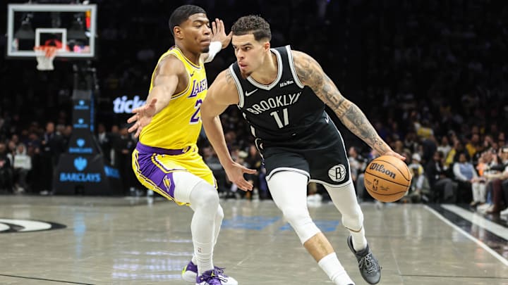 Feb 3, 2026; Brooklyn, New York, USA;  Brooklyn Nets forward Michael Porter Jr. (17) drives past Los Angeles Lakers forward Rui Hachimura (28) in the first quarter at Barclays Center. Mandatory Credit: Wendell Cruz-Imagn Images