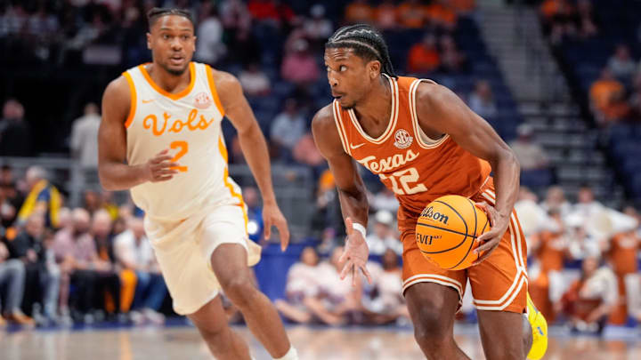 Texas guard Tramon Mark (12) drives past Tennessee guard Chaz Lanier (2) during the first half of a Southeastern Conference tournament quarterfinal game at Bridgestone Arena in Nashville, Tenn., Friday, March 14, 2025.
