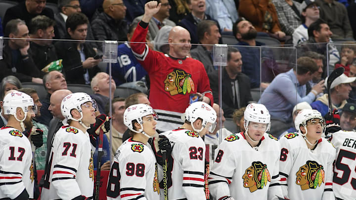 Dec 2, 2024; Toronto, Ontario, CAN; A Chicago Blackhawks fan celebrates a goal against the Toronto Maple Leafs during the third period at Scotiabank Arena. Mandatory Credit: John E. Sokolowski-Imagn Images