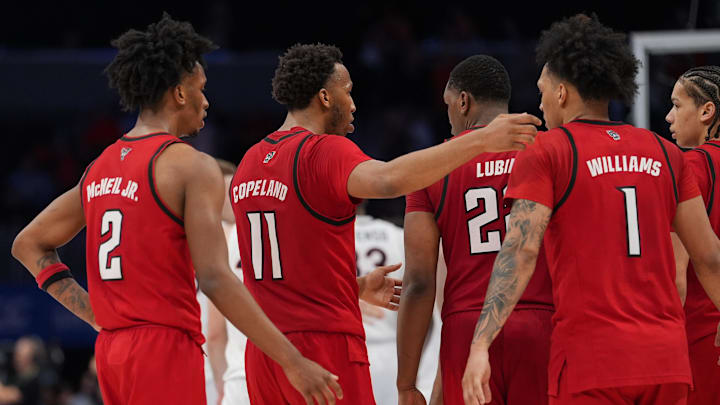 Mar 12, 2026; Charlotte, NC, USA; NC State Wolfpack players react to the loss during the second half against the Virginia Cavaliers at Spectrum Center. Mandatory Credit: Jim Dedmon-Imagn Images