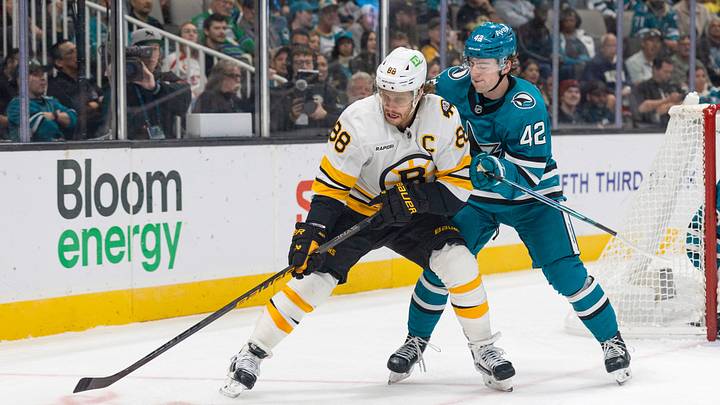 Oct 13, 2026; San Jose, California, USA; Boston Bruins right wing David Pastrnak (88) and San Jose Sharks defenseman Luca Cagnoni (42) battle for the puck during the first period at SAP Center at San Jose. Mandatory Credit: Stan Szeto-Imagn Images Oct 13, 2026; San Jose, California, USA; Boston Bruins right wing David Pastrnak (88) and San Jose Sharks defenseman Luca Cagnoni (42) battle for the puck during the first period at SAP Center at San Jose. Mandatory Credit: Stan Szeto-Imagn Images