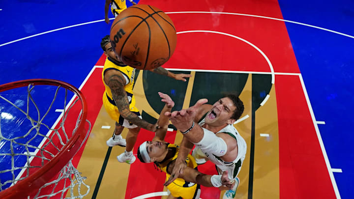 Dec 7, 2023; Las Vegas, Nevada, USA; Milwaukee Bucks center Brook Lopez (11) shoots the ball against Indiana Pacers guard Andrew Nembhard (2) in the NBA In Season Tournament Semifinal at T-Mobile Arena. Mandatory Credit: Kyle Terada-Imagn Images