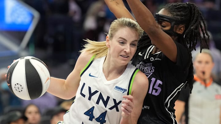 Jun 1, 2025; San Francisco, California, USA; Minnesota Lynx forward Karlie Samuelson (44) dribbles against Golden State Valkyries guard Tiffany Hayes (15) during the second quarter at Chase Center. Mandatory Credit: Darren Yamashita-Imagn Images