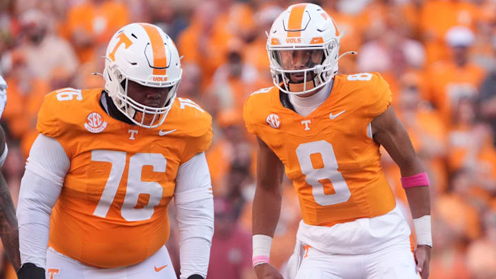 Tennessee quarterback Nico Iamaleava (8) talks with Tennessee offensive lineman Javontez Spraggins (76) during the NCAA college football game against Alabama on Saturday, Oct. 19, 2024, in Knoxville. Tenn.