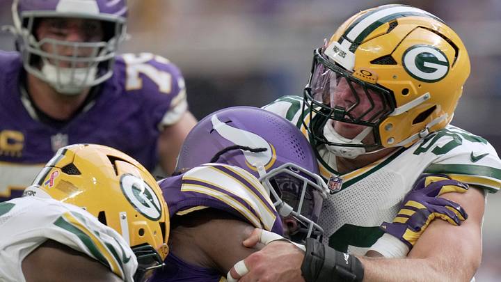 Green Bay Packers defensive end Lukas van Ness (90) stops Minnesota Vikings running back Aaron Jones. Green Bay Packers defensive end Lukas van Ness (90) stops Minnesota Vikings running back Aaron Jones.