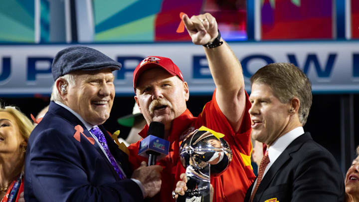 Feb 12, 2023; Glendale, Arizona, US; Fox host Terry Bradshaw (left) interviews Kansas City Chiefs head coach Andy Reid (center) as he celebrates with team owner Clark Hunt and the Vince Lombardi Trophy after winning Super Bowl LVII against the Philadelphia Eagles at State Farm Stadium. Mandatory Credit: Mark J. Rebilas-Imagn Images