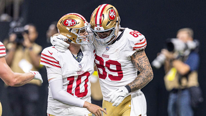 Sep 14, 2025; New Orleans, Louisiana, USA;  San Francisco 49ers quarterback Mac Jones (10) celebrate a touchdown pass to tight end Luke Farrell (89) against the New Orleans Saints during the first half at Caesars Superdome. Mandatory Credit: Stephen Lew-Imagn Images