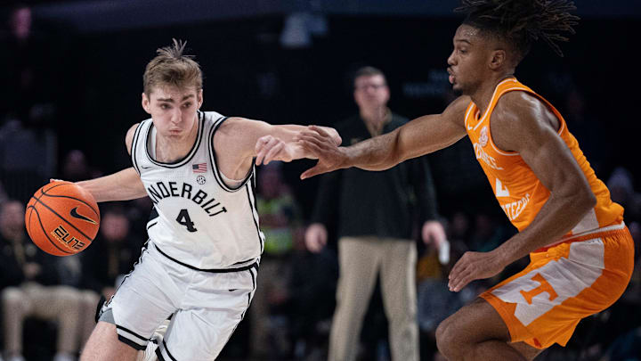 Vanderbilt Commodores guard Grant Huffman (4) drives against Tennessee Volunteers guard Chaz Lanier (2) during their game at Memorial Gym in Nashville, Tenn., Saturday, Jan. 18, 2025.