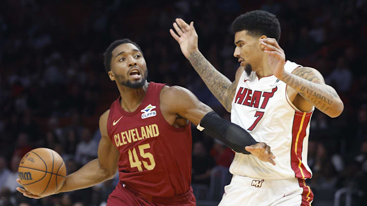 Nov 10, 2025; Miami, Florida, USA;  Miami Heat center Kel'el Ware (7) defends Cleveland Cavaliers guard Donovan Mitchell (45) during the first period at Kaseya Center. Mandatory Credit: Rhona Wise-Imagn Images